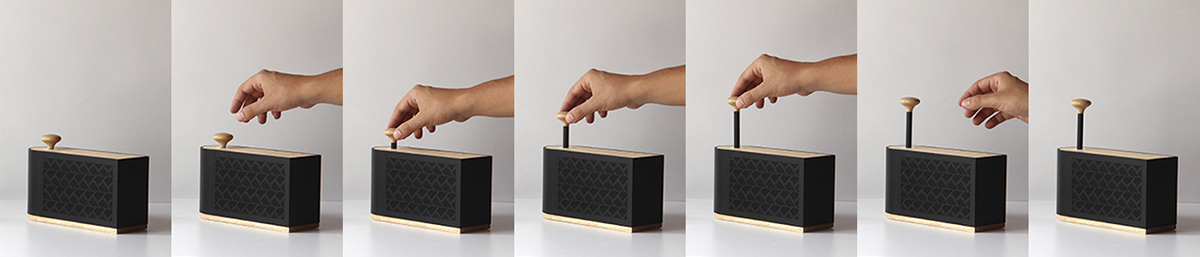 Table lamp design，sound design ，speaker，lamps and lanterns，Creative brain hole，Cylinder design，Wood and plastic，Innovative switching mode，Wind energy，Black and white matching，White and wood，