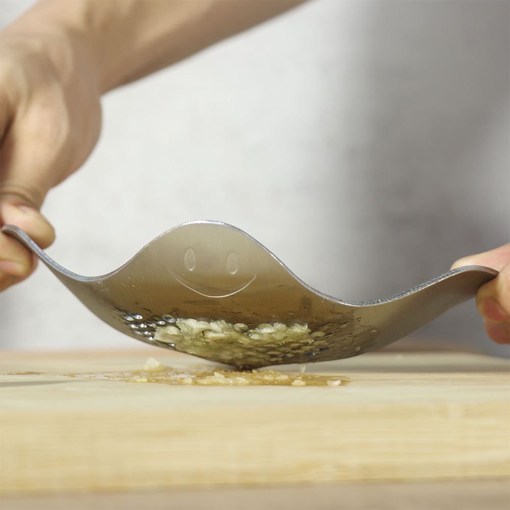 # Devil fish，# Kitchenware，smile，A garlic press，