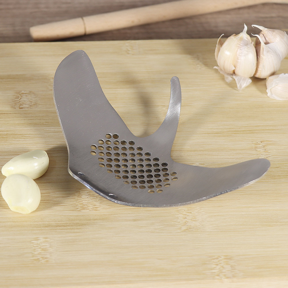 # Devil fish，# Kitchenware，smile，A garlic press，