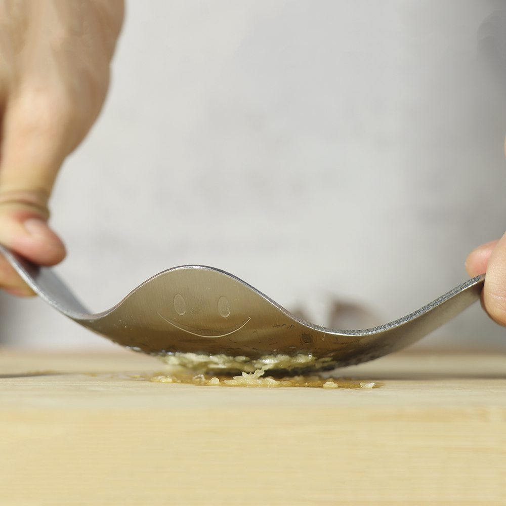 # Devil fish，# Kitchenware，smile，A garlic press，