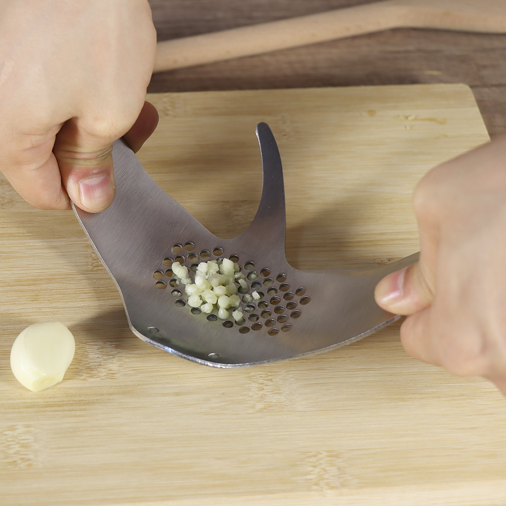 # Devil fish，# Kitchenware，smile，A garlic press，