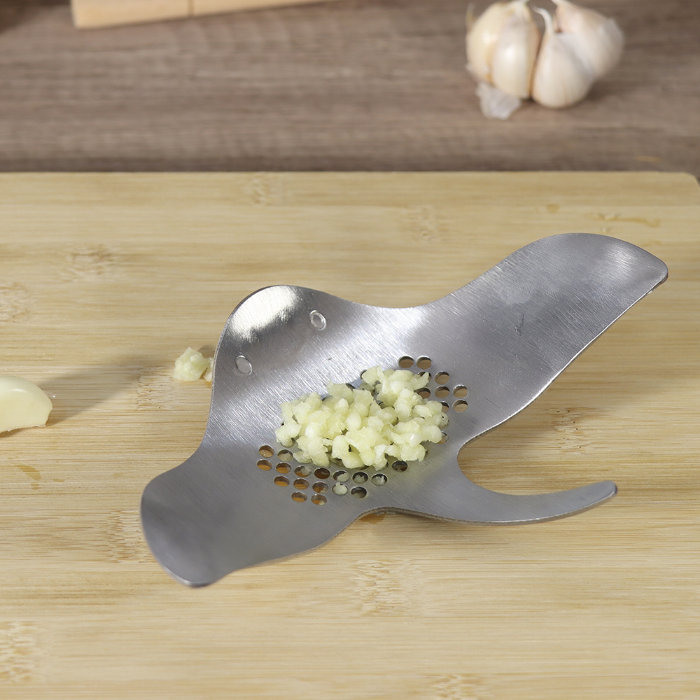 # Devil fish，# Kitchenware，smile，A garlic press，