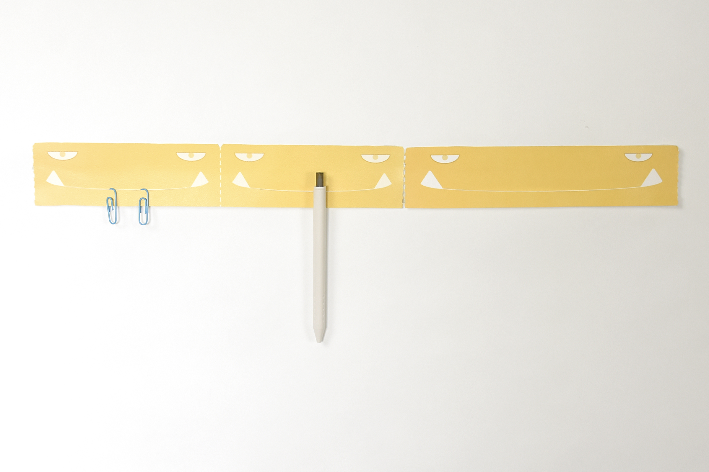 a hook，sticky note，adhesive tape，